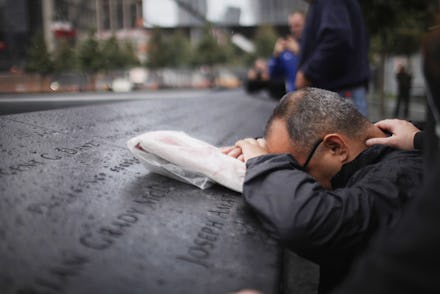 NEW YORK, NY - SEPTEMBER 20: Eddie Reyes is comforted while remembering fifteen of his colleagues i...