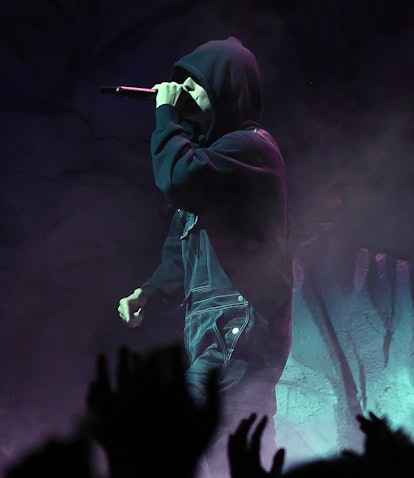 Justin Bieber performs at the 2021 MTV VMAs wearing a black hoodie.