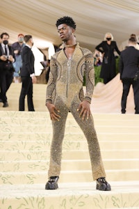 Lil Nas X in a Versace, sequined body suit at the 2021 Met Gala.