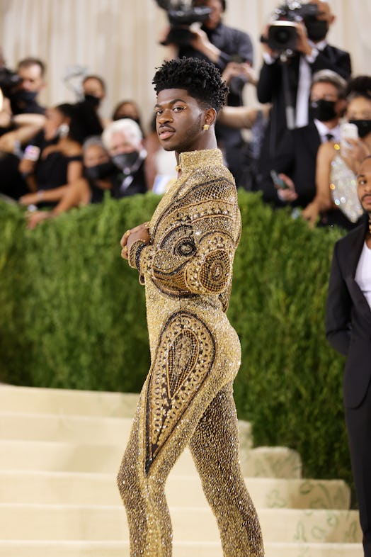 Lil Nas X's Met Gala 2021 look included 2 outfits which he removed to reveal a third: a gold catsuit...