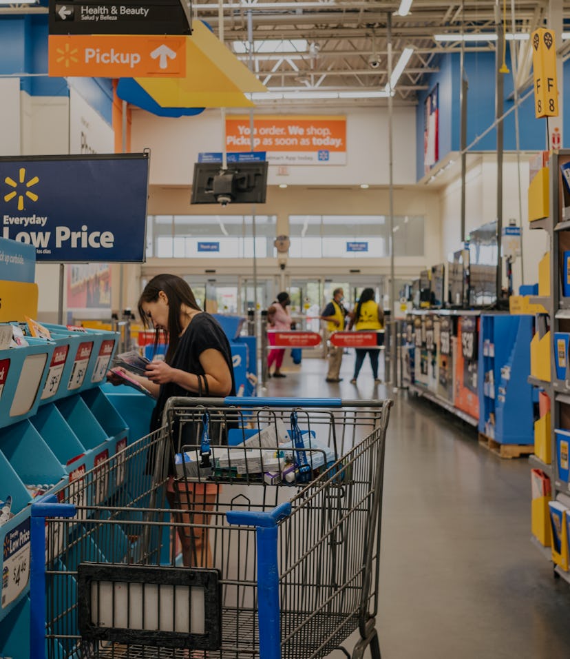 HOUSTON, TEXAS - AUGUST 04: A customer shops at a Walmart store on August 04, 2021 in Houston, Texas...