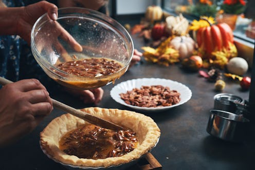 Mother and Teens Preparing Pecan Pie for the Holidays