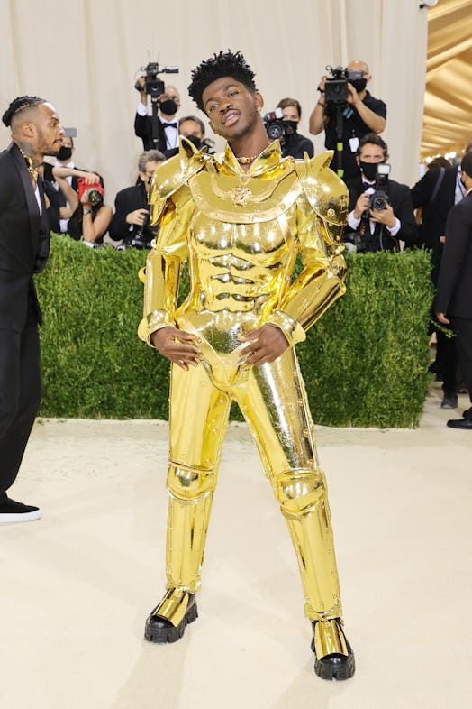 Lil Nas X's Met Gala 2021 look included 2 outfits which he removed to reveal a third: a gold catsuit...