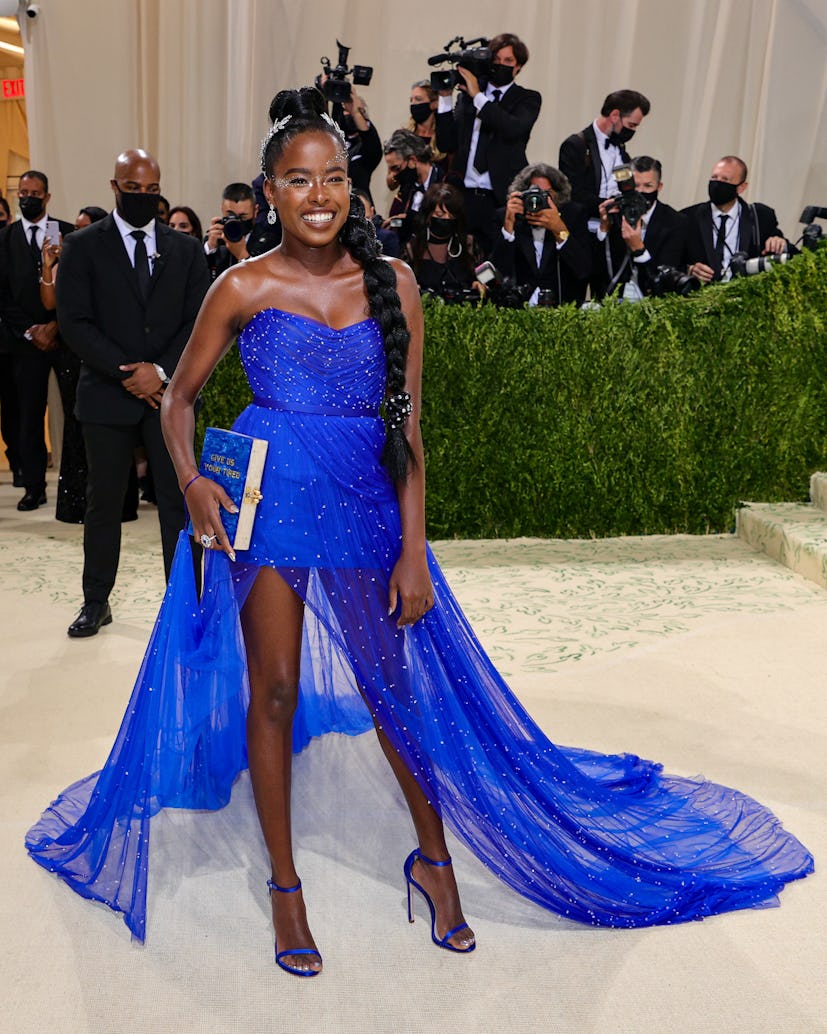 Amanda Gorman's Met Gala 2021 look was a breath of fresh air and bold color on the red carpet. And h...