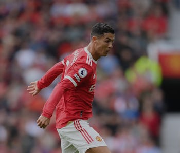 MANCHESTER, ENGLAND - SEPTEMBER 11: Cristiano Ronaldo runs with the ball during the Premier League m...