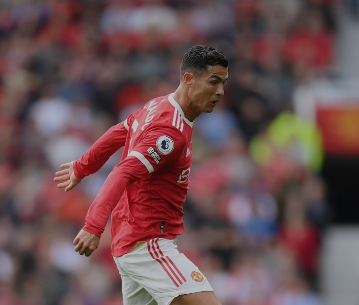 MANCHESTER, ENGLAND - SEPTEMBER 11: Cristiano Ronaldo runs with the ball during the Premier League m...