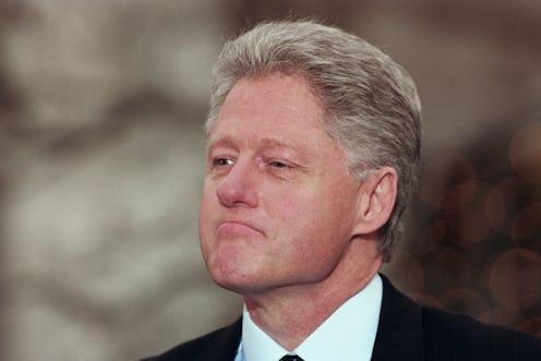 President Bill Clinton reacts to being impeached by the House of Representatives during a news confe...