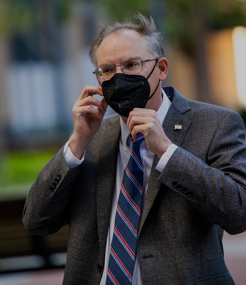 OAKLAND, CA - MAY 20: Epic Games CEO Tim Sweeney dons a mask as he arrives at the United States Dist...
