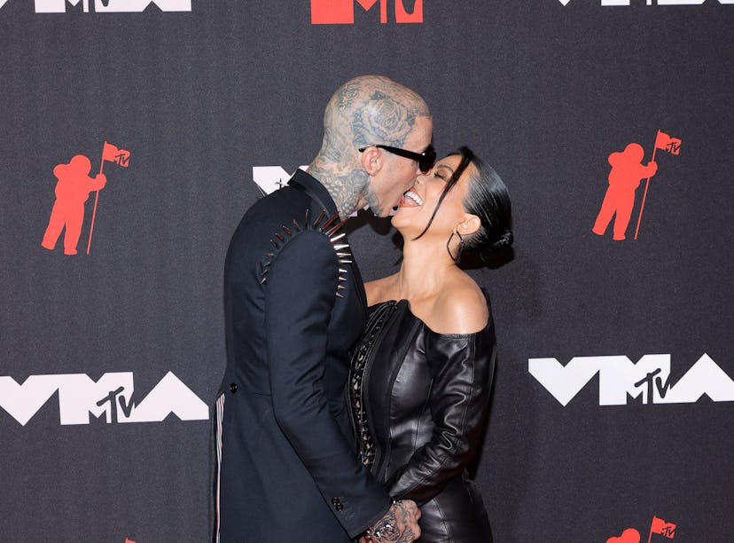 Kourtney Kardashian and Travis Barker's body language the VMAs was hot and heavy.