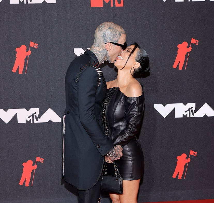 Kourtney Kardashian and Travis Barker's body language the VMAs was hot and heavy.