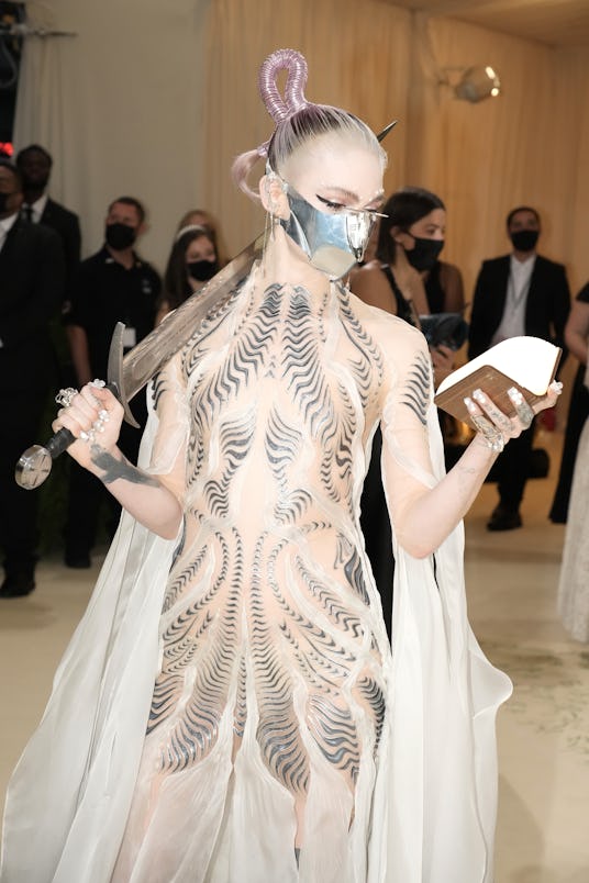 NEW YORK, NEW YORK - SEPTEMBER 13: Grimes attends The 2021 Met Gala Celebrating In America: A Lexico...