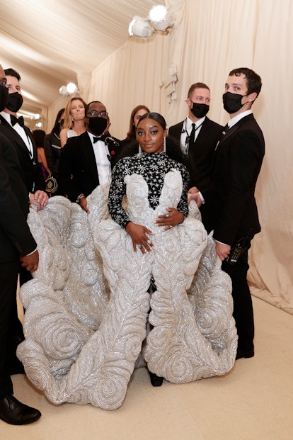 Simone Biles attends The 2021 Met Gala with an entourage to carry her gown