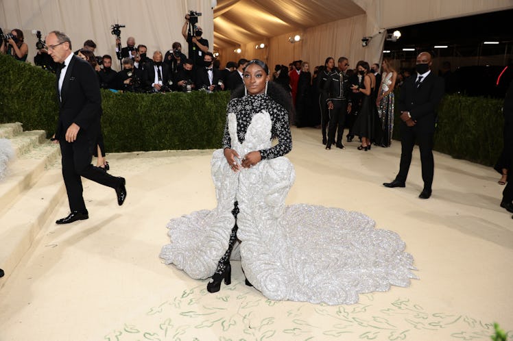 Simone Biles attends The 2021 Met Gala in an 88-pound dress.