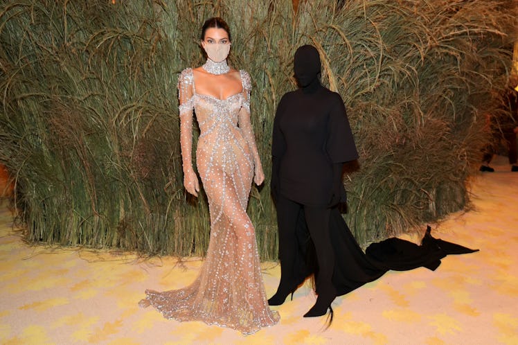 Kendall Jenner and Kim Kardashian attend the The 2021 Met Gala.