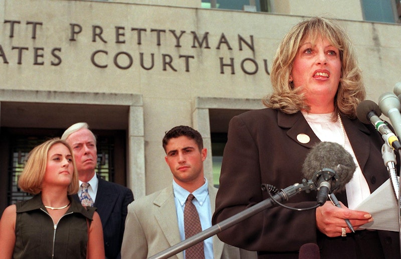 Linda Tripp (R) speaks to the press in front of the Federal Courthouse 29 July in Washington, DC, af...