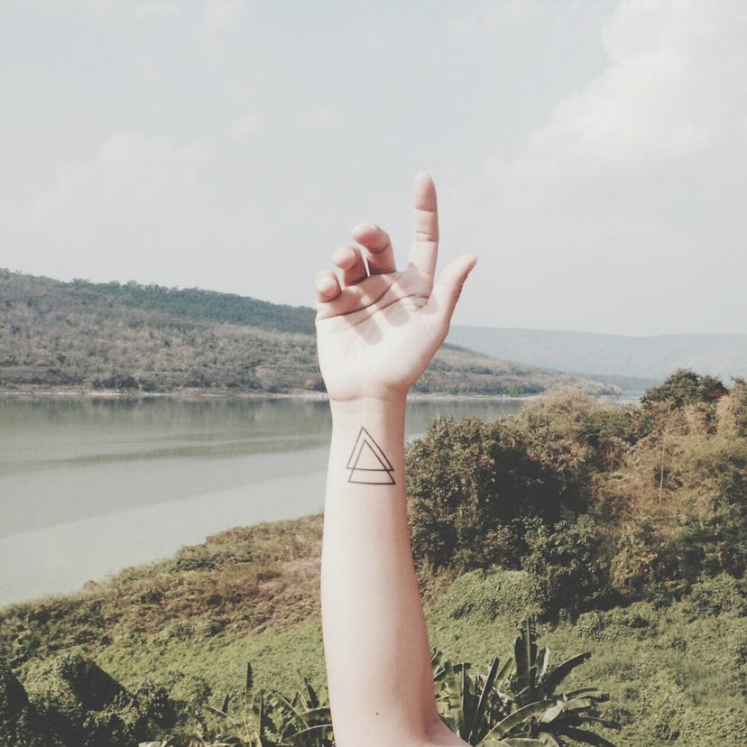 Matching minimalist tattoos for families: triangles