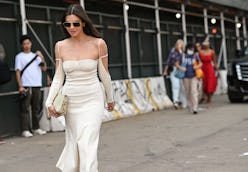 NEW YORK, NEW YORK - SEPTEMBER 12:  Kat Collings is seen wearing a white Jacquemus dress outside the...