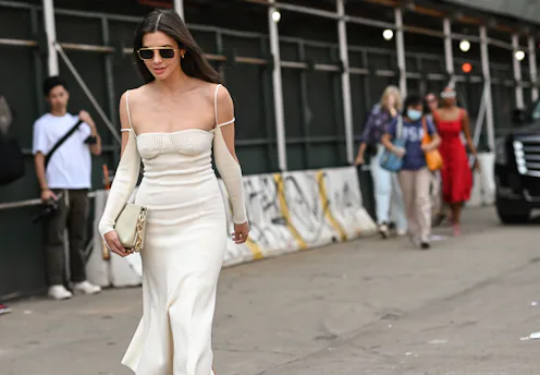 NEW YORK, NEW YORK - SEPTEMBER 12: Kat Collings is seen wearing a white Jacquemus dress outside the...