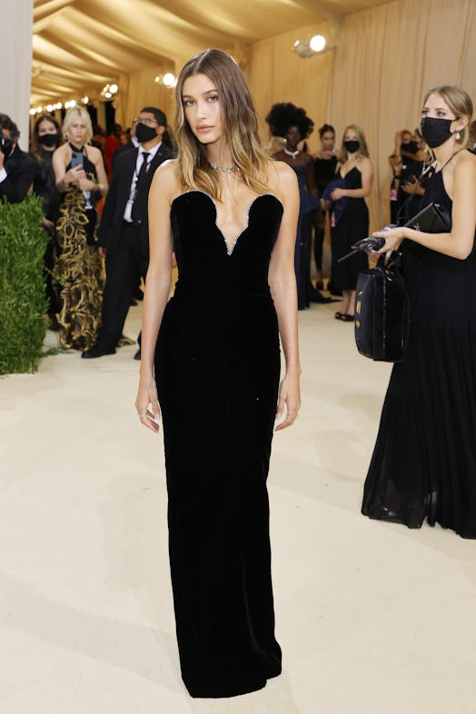 Hailey Bieber's Met Gala 2021 look included a velvet bodice and a dramatic plunging neckline.
