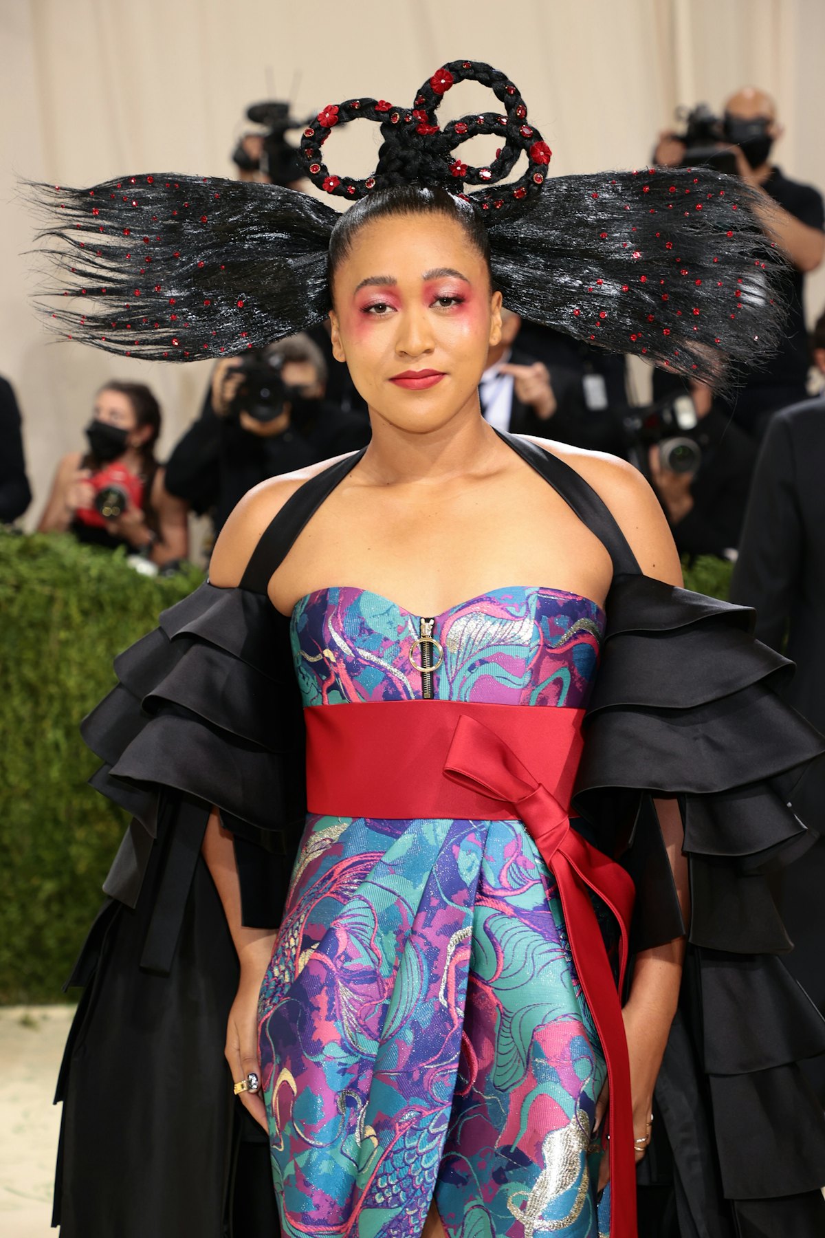 Naomi Osaka's Met Gala 2021 beauty featured Glossier’s Generation G Lipstick in Zip on her eyes, lip...