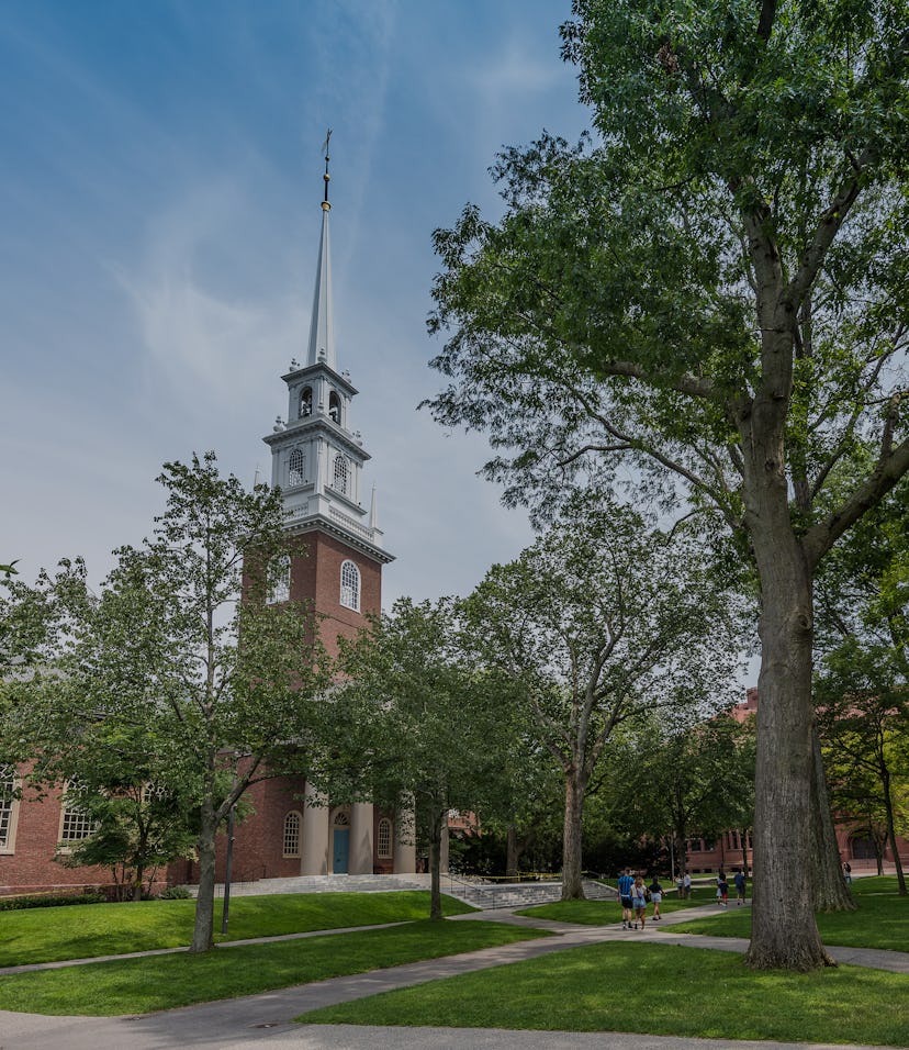 Cambridge, MA, USA - August 7, 2021: View of tourist taking selfies in from of Memorial Church Apple...