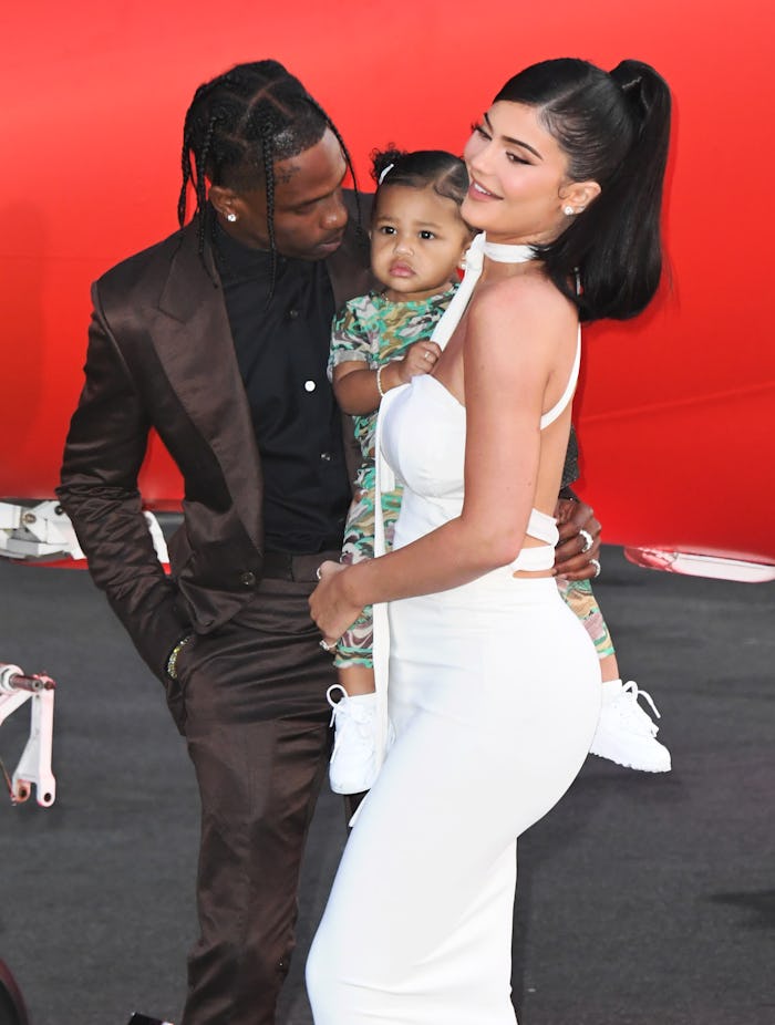 SANTA MONICA, CALIFORNIA - AUGUST 27: Travis Scott, Stormi Webster and Kylie Jenner attend the Prem...