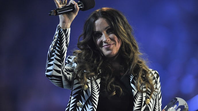 HAMILTON, ON - MARCH 15:  Alanis Morissette is presented an award at the 2015 JUNO Awards at FirstOn...