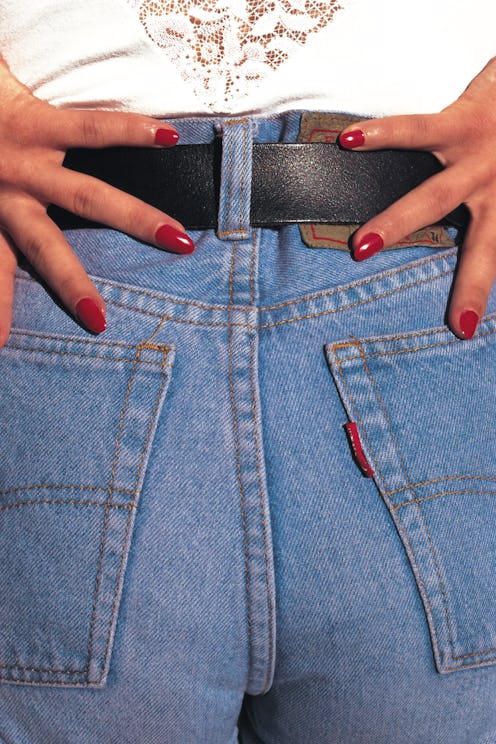 A woman's butt in jeans close up. Wondering why does my butt smell? Experts explain the answers to "...