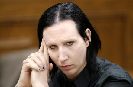Brian Warner, better known as Marilyn Manson, listens during his preliminary examination 28 December...