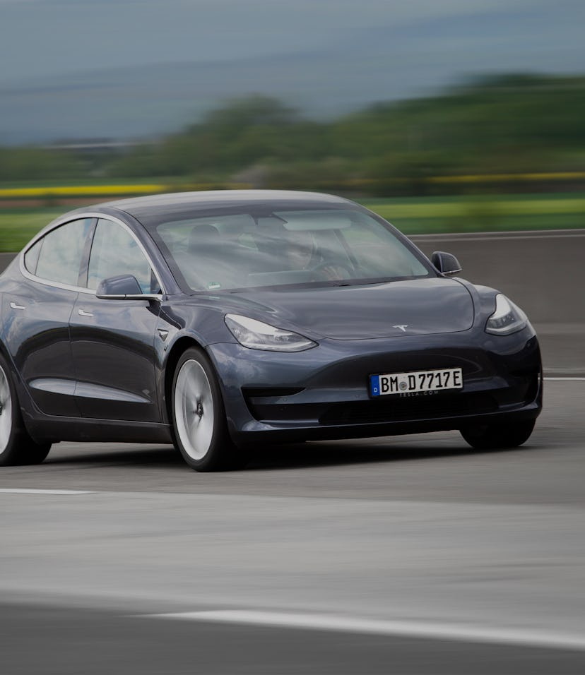 Diedenbergen, Germany - May 12, 2021: Tesla Model 3 on a highway nearby Wiesbaden in Germany. The Te...