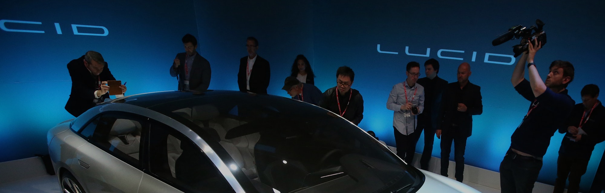 Journalists look over the new "air" electric car by Lucid Motors Inc. on Wednesday, Dec. 14, 2016, i...