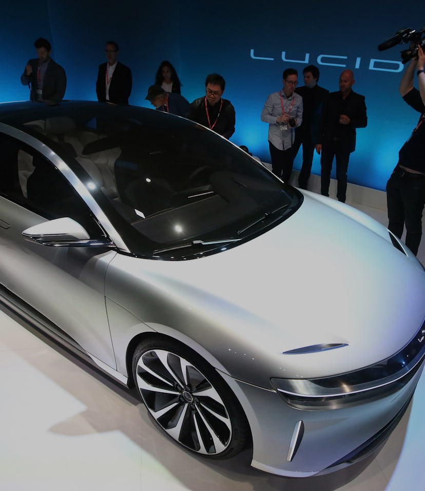 Journalists look over the new "air" electric car by Lucid Motors Inc. on Wednesday, Dec. 14, 2016, i...