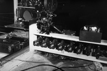 A collection of movie cameras waits ready to photograph the Trinity nuclear weapon test, near Los Al...