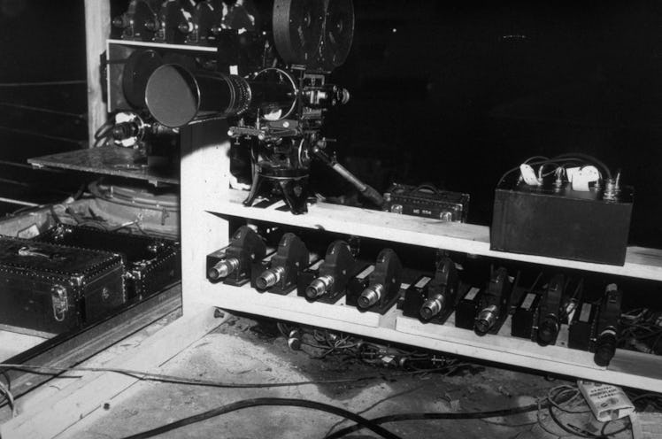 A collection of movie cameras waits ready to photograph the Trinity nuclear weapon test, near Los Al...