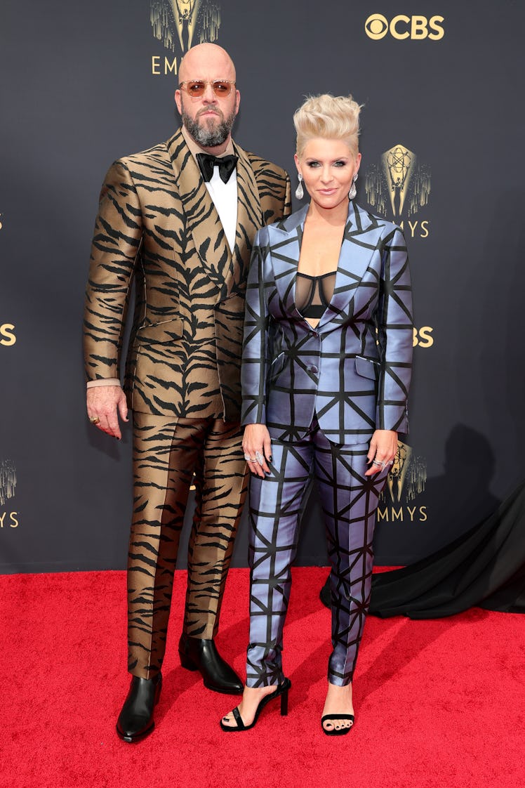 Chris Sullivan in a Zebra-print brown suit and Rachel Sullivan in a blue-black suit at the Emmys Red...