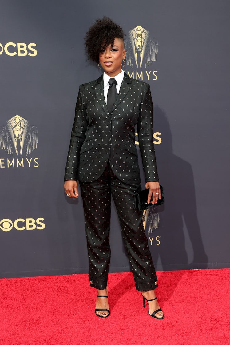Samira Wiley in a black-white polka-dot suit, a white shirt and a black tie at the Emmys Red Carpet ...
