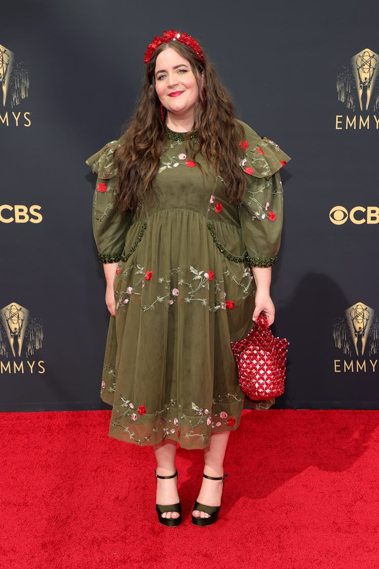 Aidy Bryant in a green-red floral dress at the Emmys Red Carpet 2021