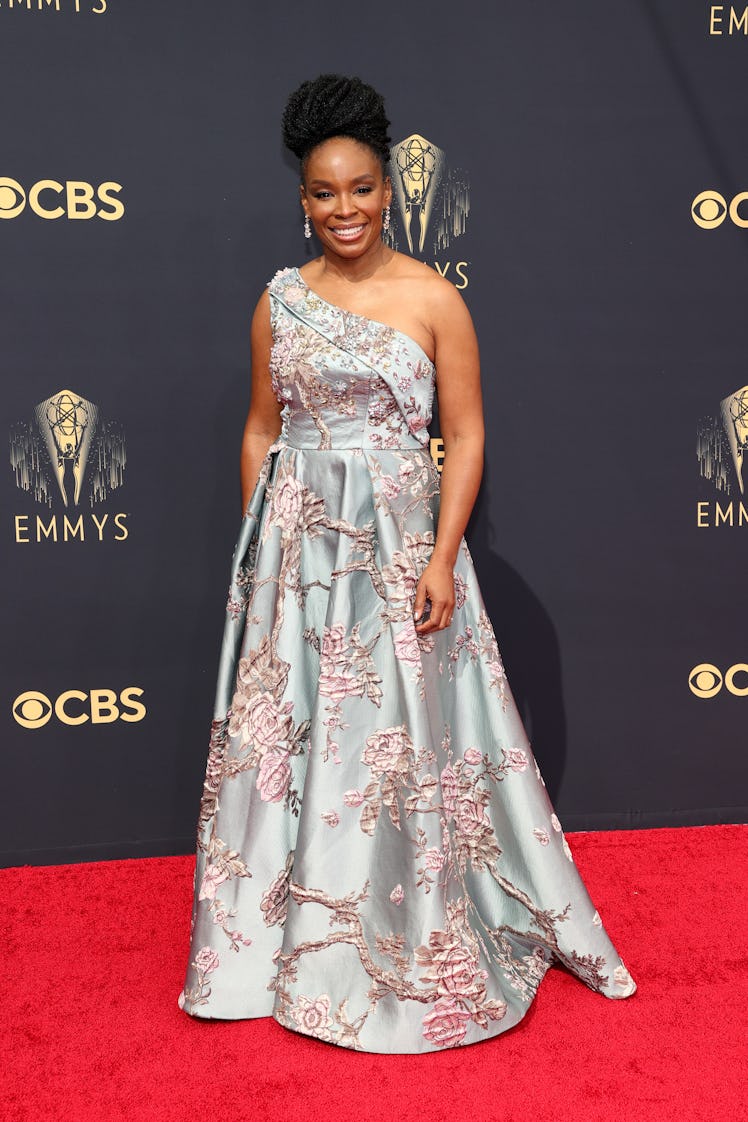 Amber Ruffin in a blue-pink floral dress at the Emmys Red Carpet 2021