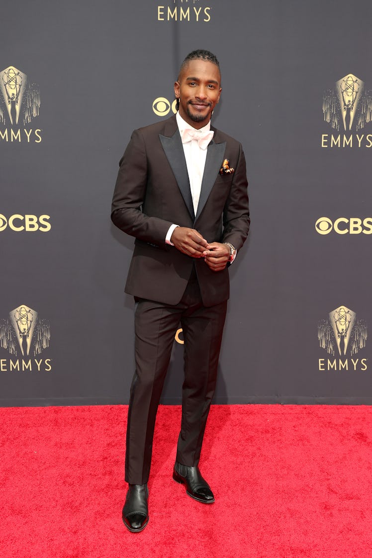 Scott Evans in a black suit, a white shirt and a white bow tie at the Emmys Red Carpet 2021