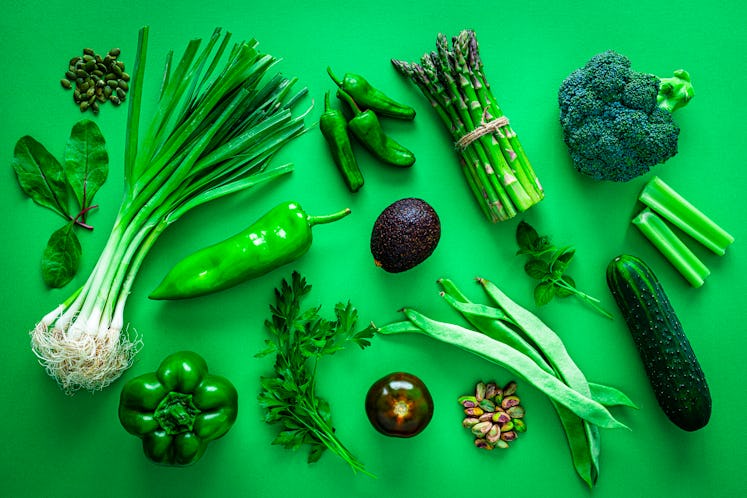 Green vegetables on a green background 