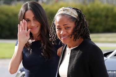 US actress and fiancee of Britain's Prince Harry Meghan Markle (L) arrives with her mother Doria Rag...