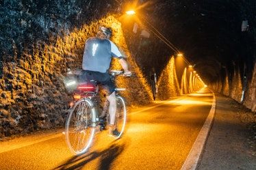01 September 2019, Hessen, Hoifbieber: A cyclist is on his way through the Milseburg Tunnel in the l...