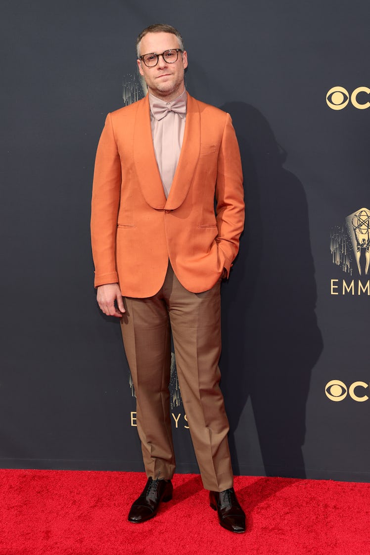 Seth Rogen in a beige shirt, orange blazer and brown trousers at the Emmys Red Carpet 2021