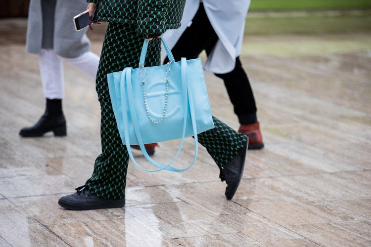 PARIS, FRANCE - MARCH 02: A guest is seen wearing blue bag outside Y/Project during Paris Fashion We...