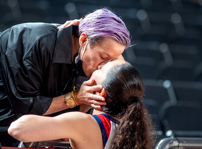 Sue Bird and Megan Rapinoe kiss at the Tokyo Olympics, nearly a year after they got engaged.