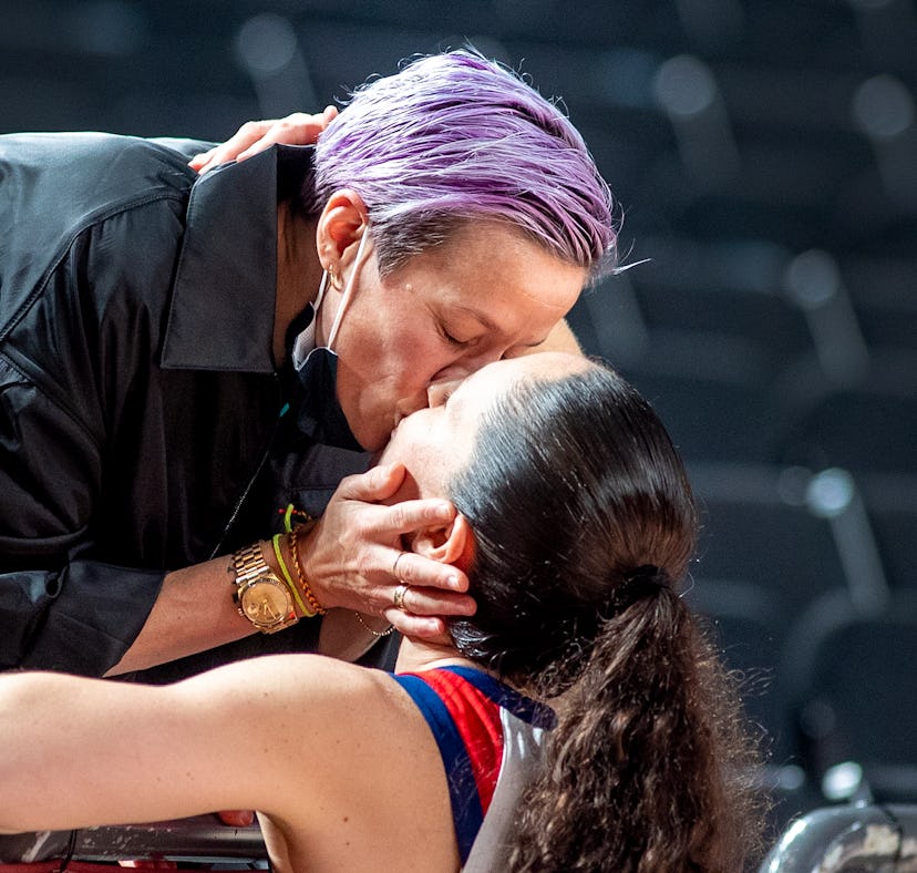Sue Bird and Megan Rapinoe kiss at the Tokyo Olympics, nearly a year after they got engaged.