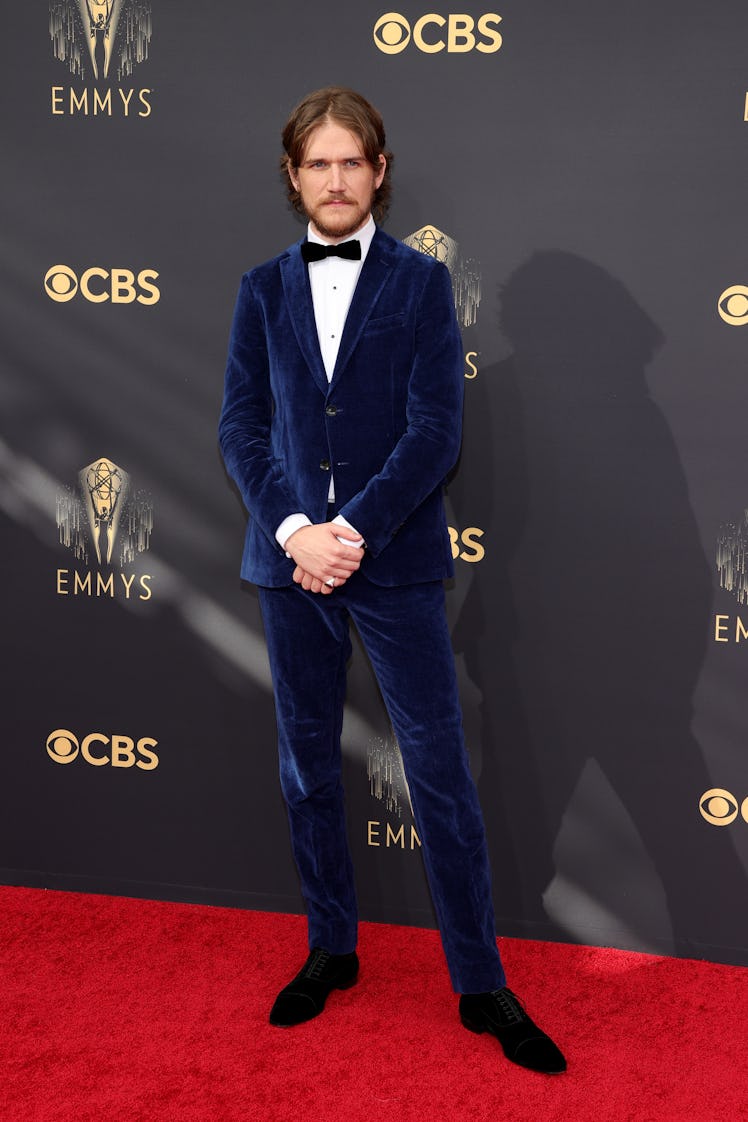 Bo Burnham in a blue velvet suit, a white shirt and a black bow tie at the Emmys Red Carpet 2021