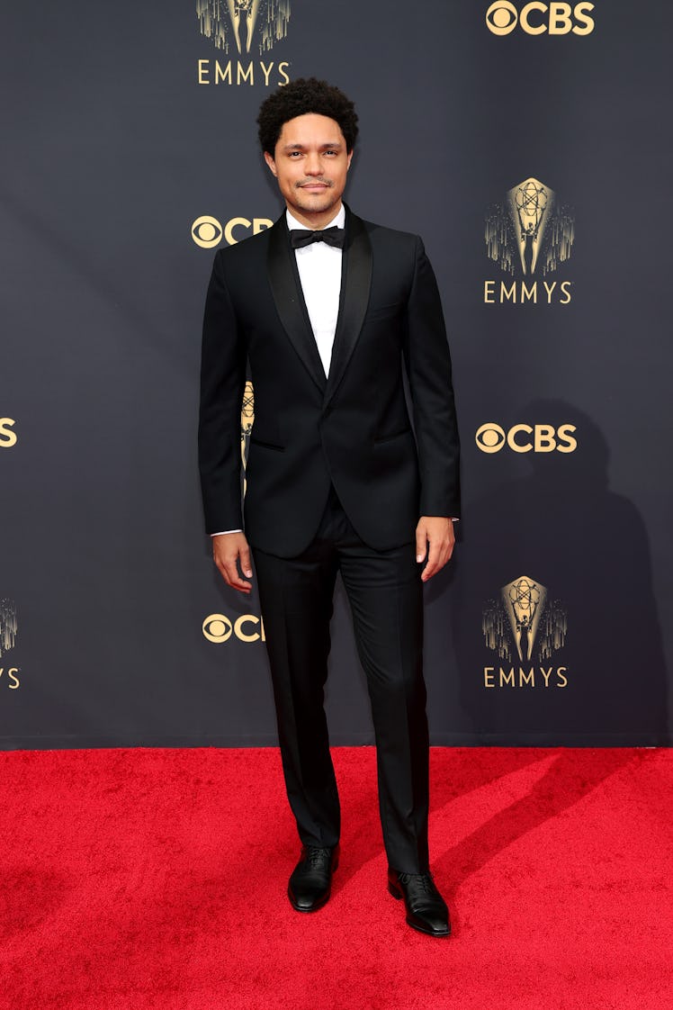 Trevor Noah in a black suit, a white shirt, and a black bow tie at the Emmys Red Carpet 2021