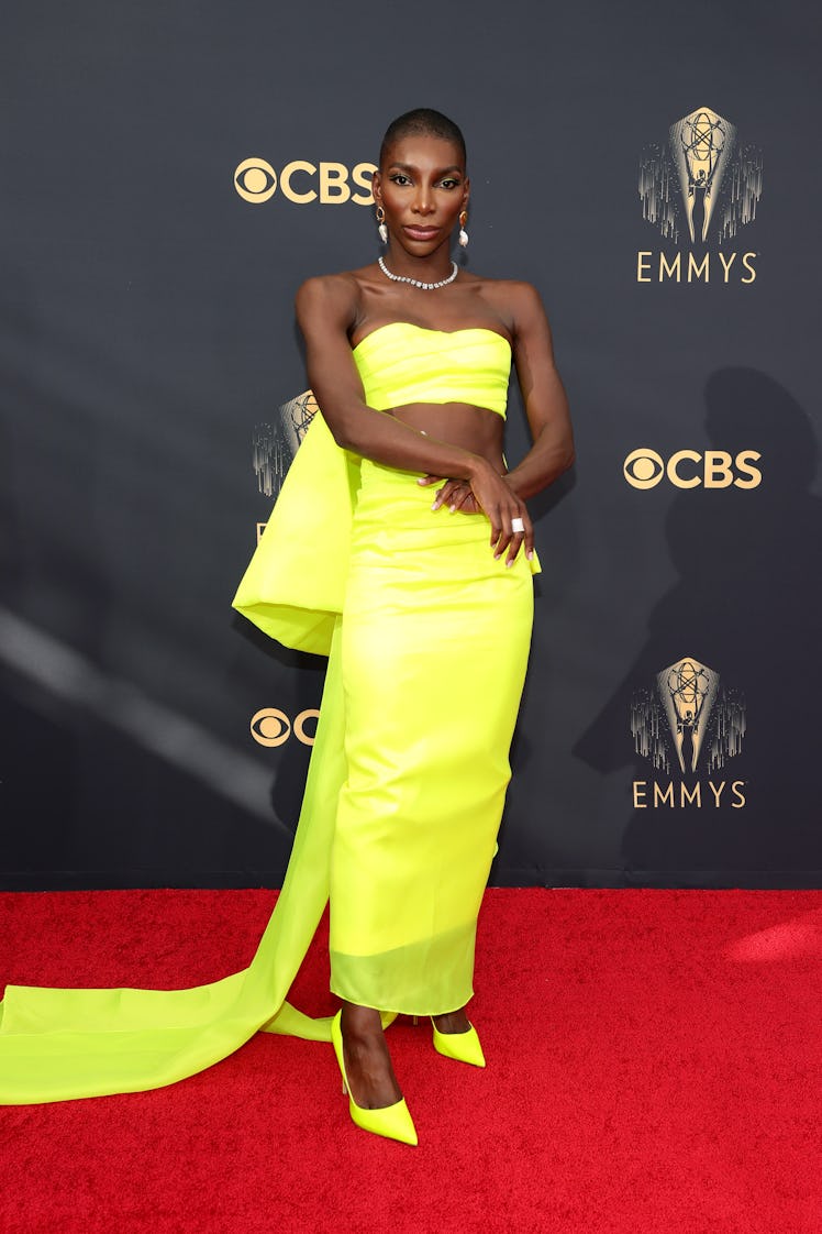 Michaela Coel in a yellow crop top and skirt at the Emmys Red Carpet 2021