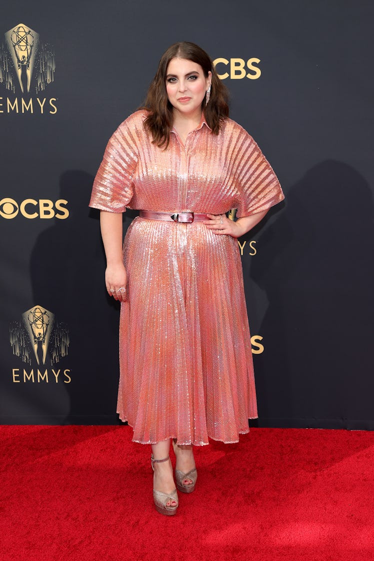 Beanie Feldstein in a peach metallic dress at the Emmys Red Carpet 2021